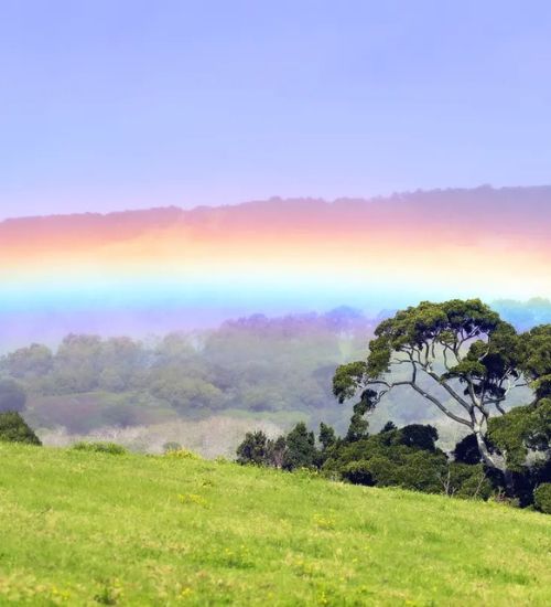 A landscape shot of Jamberoo with a rainbow.